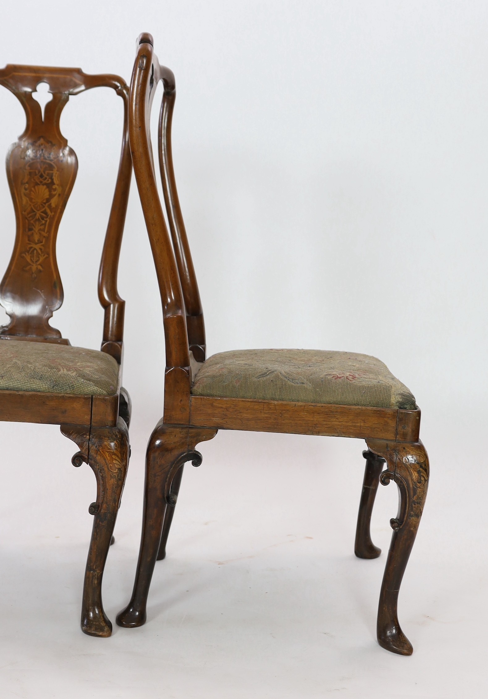 A pair of George I walnut and marquetry side chairs, c.1720, Restorations